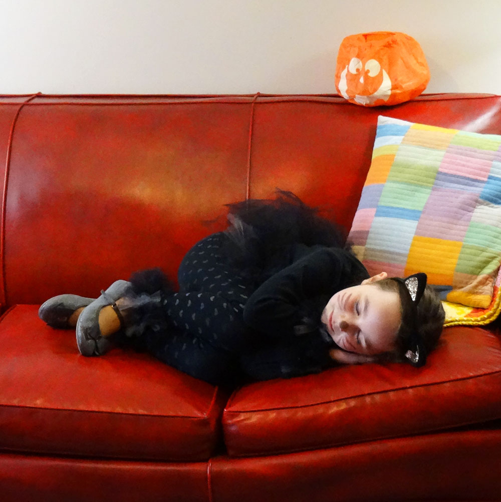 Black Cat Costume Sleeping