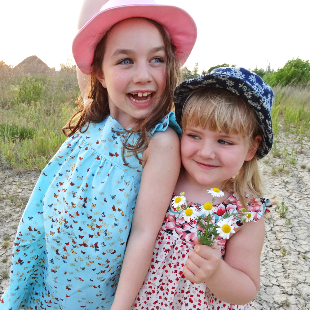 Two Fedoras and some flowers