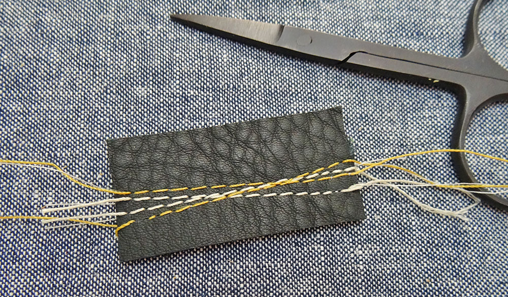 Trim the extra threads on your leather label Trim the extra threads on your leather label