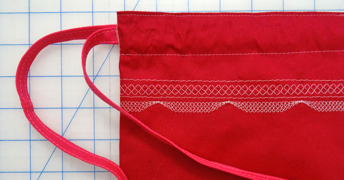 Insert left side strap through casing