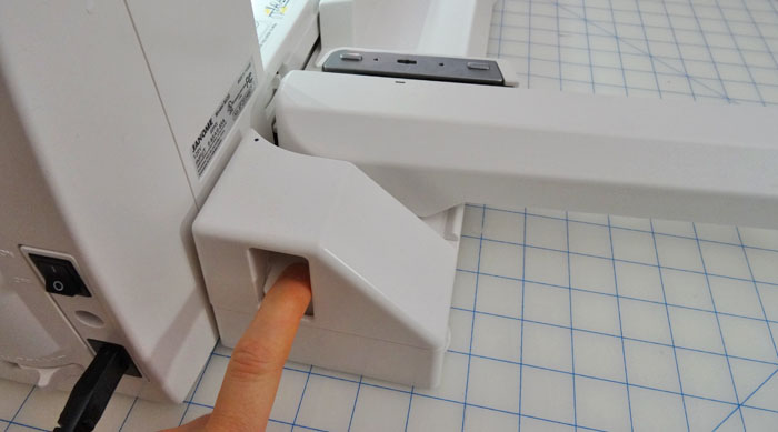 Press to close the embroidery arm