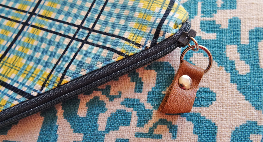 Zipper Pouch Leather Pull Closeup